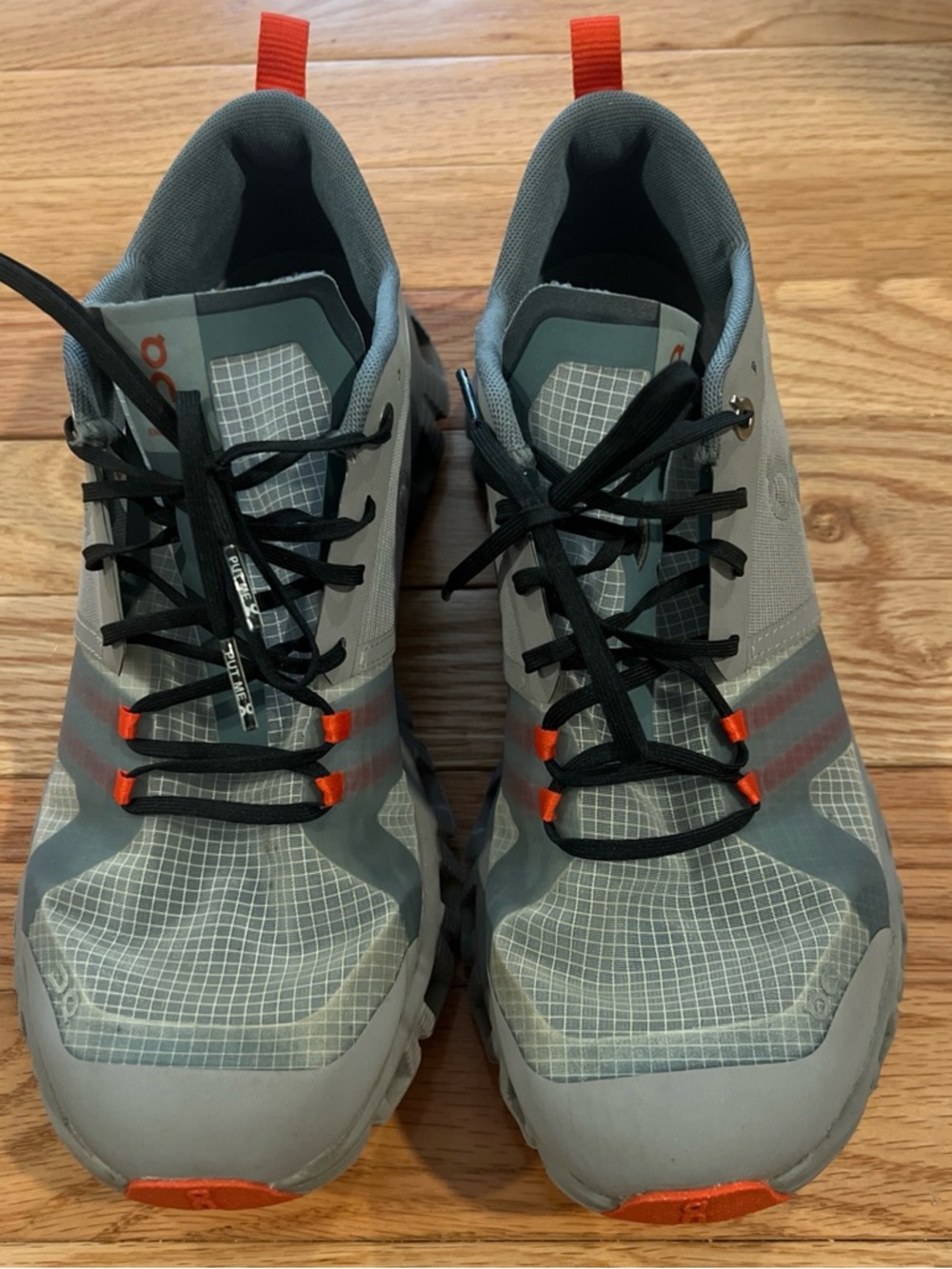 On Cloud Women’s  Grey and Orange Trail Running Shoes